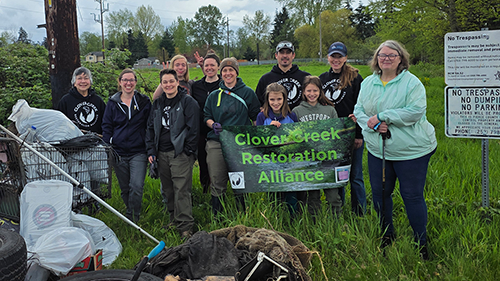 Group Photo of Volunteers Working At A Clover Creek Restoration Alliance Clean Up Event